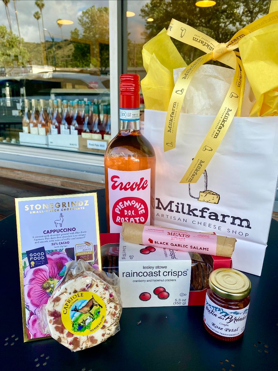 Mother's day gift bag with cheese, crackers, jam, wine, salami and chocolate in a Milkfarm gift bag.
